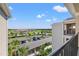 Scenic view from a balcony overlooking green spaces and parking at 18114 Gawthrop Dr # 402, Bradenton, FL 34211