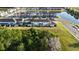 A high angle view of the homes and the surrounding community featuring a pond at 1824 Woodleaf Hammock Ct, Bradenton, FL 34211
