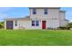 Expansive backyard featuring a well-maintained lawn and a screened in patio at 1824 Woodleaf Hammock Ct, Bradenton, FL 34211