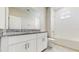 Bathroom featuring white cabinets, granite counters, tub and shower combination at 1824 Woodleaf Hammock Ct, Bradenton, FL 34211