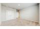 Bright bedroom featuring neutral carpeting, crisp walls, and double closets at 1824 Woodleaf Hammock Ct, Bradenton, FL 34211