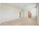 Bright bedroom with neutral carpeting, walk in closet and two doorways at 1824 Woodleaf Hammock Ct, Bradenton, FL 34211