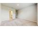 A bedroom that features neutral color walls and carpet with an adjoining bathroom at 1824 Woodleaf Hammock Ct, Bradenton, FL 34211