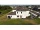Exterior of a beautiful two-story home with a well-manicured front yard and new landscaping at 1824 Woodleaf Hammock Ct, Bradenton, FL 34211