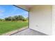 Covered patio with brick flooring and a green view of the lawn and trees beyond at 1824 Woodleaf Hammock Ct, Bradenton, FL 34211