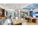 Open kitchen and living space, complete with granite countertops and a lake view at 20359 Cristoforo Pl, Venice, FL 34293