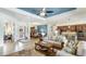 Open-concept living area with seamless flow to the kitchen and dining, complete with tile flooring at 20359 Cristoforo Pl, Venice, FL 34293