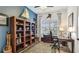 Charming home office with a built-in bookcase and ample natural light at 20359 Cristoforo Pl, Venice, FL 34293
