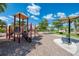 Fun playground area featuring a slide, climbing structure, and a shaded seating area at 20359 Cristoforo Pl, Venice, FL 34293