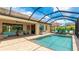 Beautiful pool with a sitting area and plenty of space for entertaining at 20359 Cristoforo Pl, Venice, FL 34293