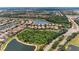 Scenic aerial shot of a residential area with homes near winding lakes and green spaces at 207 Winding River Trl, Bradenton, FL 34212
