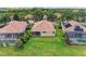 A well-maintained backyard featuring lush green grass and a cozy patio, perfect for outdoor relaxation at 207 Winding River Trl, Bradenton, FL 34212