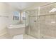 Bathroom with soaking tub, tiled shower with glass door, and window for natural light at 207 Winding River Trl, Bradenton, FL 34212