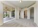 Open bedroom area with access to a screened patio and an attached room at 207 Winding River Trl, Bradenton, FL 34212