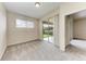 Bright bedroom with a backyard view through sliding doors and plush carpeting at 207 Winding River Trl, Bradenton, FL 34212