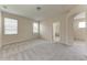 Spacious bedroom featuring neutral walls, plush carpet, and abundant natural light from two windows at 207 Winding River Trl, Bradenton, FL 34212