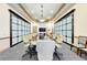 Boardroom featuring large conference table, neutral colored chairs, and natural light at 207 Winding River Trl, Bradenton, FL 34212