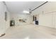 This spacious garage features ample room for parking, storage, and working at 207 Winding River Trl, Bradenton, FL 34212