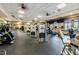The gym features modern exercise equipment and ceiling fans to keep you cool during your workouts at 207 Winding River Trl, Bradenton, FL 34212