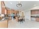 Modern kitchen with stainless appliances, a breakfast bar, and tiled flooring at 207 Winding River Trl, Bradenton, FL 34212