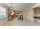 Modern kitchen with stainless appliances, a breakfast bar, and tiled flooring at 207 Winding River Trl, Bradenton, FL 34212