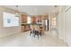 Modern kitchen with stainless appliances, a breakfast bar, and tiled flooring at 207 Winding River Trl, Bradenton, FL 34212