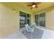 This screened-in lanai provides a peaceful spot to relax and enjoy the outdoors at 207 Winding River Trl, Bradenton, FL 34212