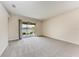Spacious living room with screened-in porch access overlooking the water at 207 Winding River Trl, Bradenton, FL 34212