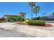 The tennis center entrance has an attractive exterior, lush greenery, and palm trees at 207 Winding River Trl, Bradenton, FL 34212