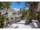 Outdoor deck with bar, seating, grill, fire table, and privacy fence for entertaining at 2207 Hickory Ave, Sarasota, FL 34234