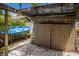 Backyard shed with a covered structure, kayak, and ample storage at 2207 Hickory Ave, Sarasota, FL 34234