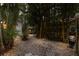 Tranquil backyard landscape featuring a stone pathway and bamboo at 2207 Hickory Ave, Sarasota, FL 34234