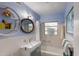 Bright and inviting bathroom with modern fixtures, unique shelving, and a clean, minimalist design at 2207 Hickory Ave, Sarasota, FL 34234