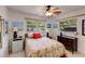 Comfortable bedroom with large windows, natural light, and stylish furnishings, perfect for relaxation at 2207 Hickory Ave, Sarasota, FL 34234