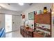 Entryway featuring stylish mid-century modern decor, art, and ample storage at 2207 Hickory Ave, Sarasota, FL 34234