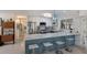 Open kitchen with a breakfast bar, modern lighting, stainless steel appliances, and eat in breakfast table at 2207 Hickory Ave, Sarasota, FL 34234