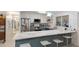 Modern kitchen with stainless steel appliances, a quartz countertop, and stylish bar seating at 2207 Hickory Ave, Sarasota, FL 34234