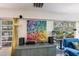 Brightly lit living area highlighting colorful artwork and comfortable blue seating area with exterior view at 2207 Hickory Ave, Sarasota, FL 34234