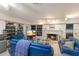 Inviting living room featuring a cozy fireplace, comfortable seating, and large windows at 2207 Hickory Ave, Sarasota, FL 34234