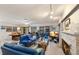 Spacious living room with comfortable seating, fireplace, and large windows offering views at 2207 Hickory Ave, Sarasota, FL 34234