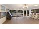 Bright living room with large windows offering views of the front yard, featuring modern decor at 2207 Hickory Ave, Sarasota, FL 34234