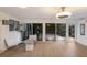Stylish living room with ample natural light and access to an outdoor patio area at 2207 Hickory Ave, Sarasota, FL 34234