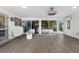 Bright sunroom with floor to ceiling windows and a view of the backyard at 2207 Hickory Ave, Sarasota, FL 34234