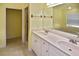 Bathroom featuring double sinks, tile floors, and separate shower at 2371 Manheim Ave, North Port, FL 34286