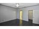 Large bedroom with ceiling fan and multiple doorways at 2371 Manheim Ave, North Port, FL 34286