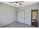 Neutral bedroom features closet with bifold doors and a door that leads to another room at 2371 Manheim Ave, North Port, FL 34286