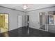 Spacious bedroom with dark wood floors and sliding glass doors at 2371 Manheim Ave, North Port, FL 34286