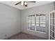 Cozy bedroom featuring a ceiling fan and bright window, perfect for relaxation at 2371 Manheim Ave, North Port, FL 34286