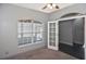 Bright bedroom with a large window and french doors leading to additional rooms at 2371 Manheim Ave, North Port, FL 34286