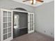 Bright bedroom with french doors leading to an ensuite bathroom at 2371 Manheim Ave, North Port, FL 34286
